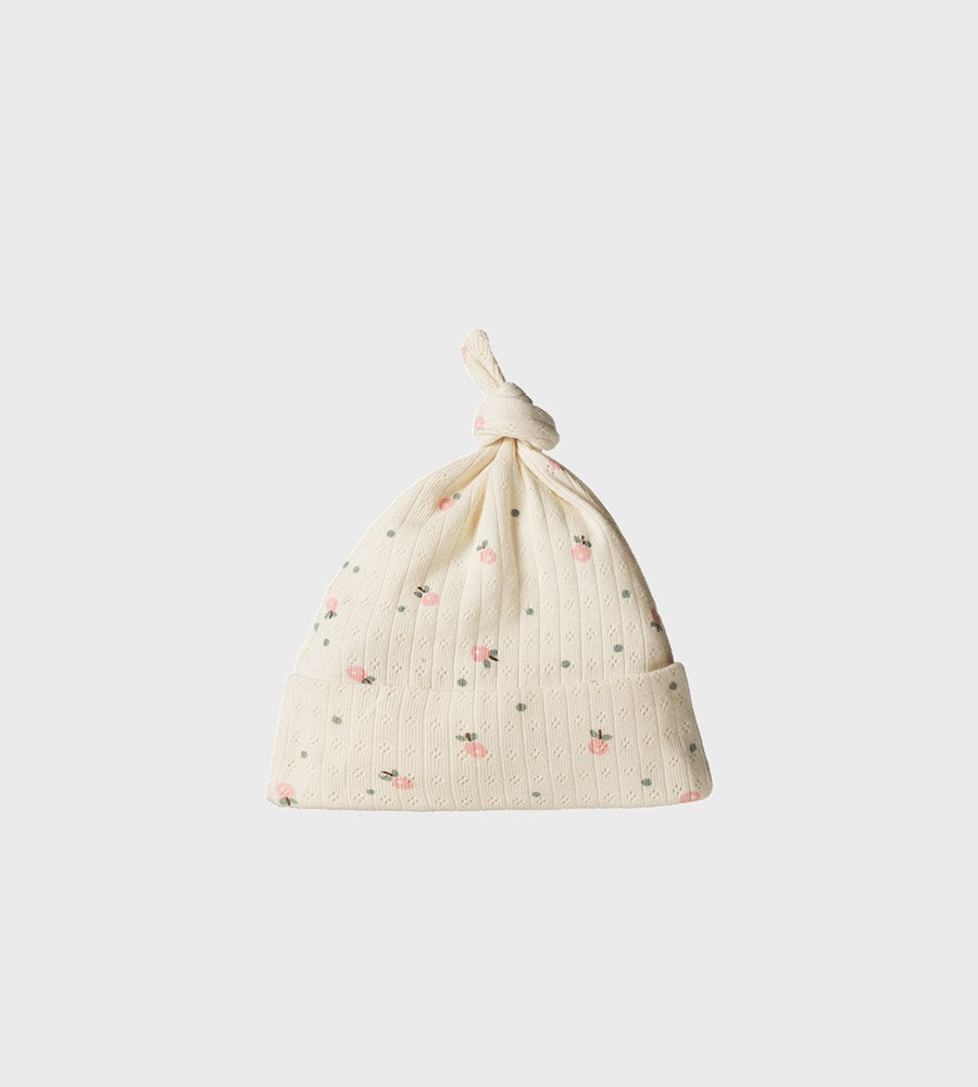 Drawstring bag with floral pattern on a light gray background