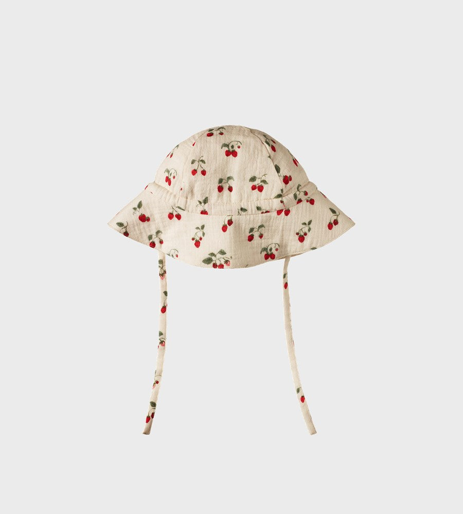Floral patterned baby bonnet on a white background