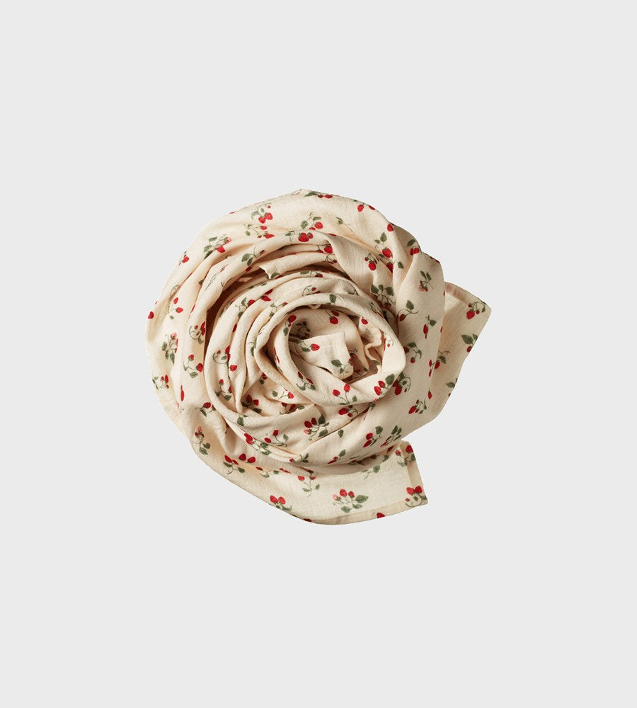 Floral-patterned fabric roll on a light gray background