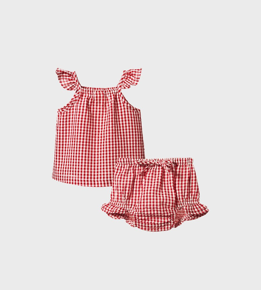 Red and white checkered top and shorts set on a light gray background