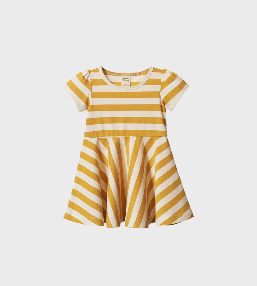 Yellow and white striped dress on a light gray background