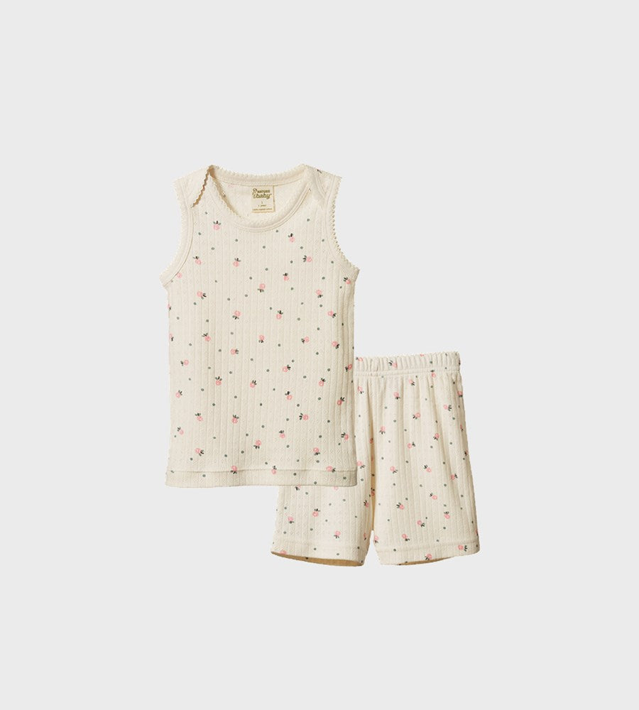 Children's sleeveless top and shorts set with a subtle pattern on a white background