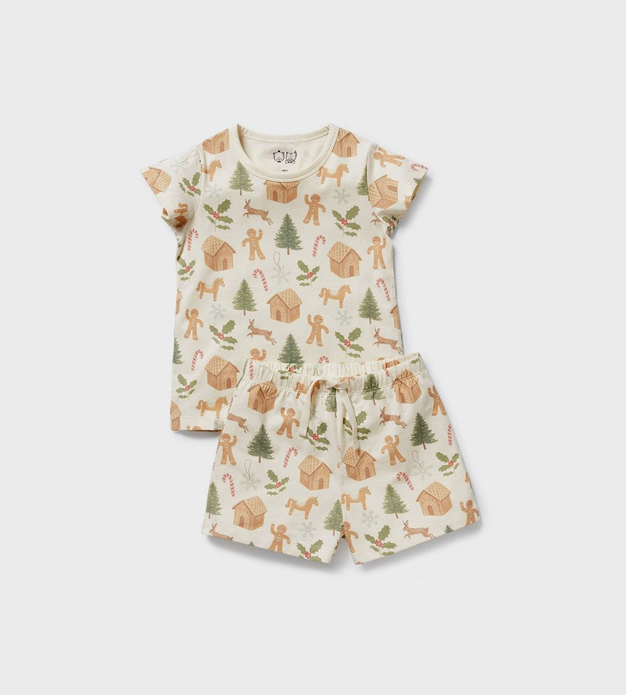 Children's pajama set with Christmas-themed pattern on a white background