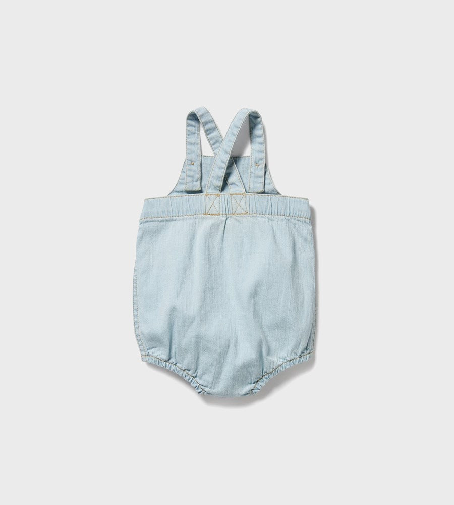 Light blue denim romper with straps on a white background