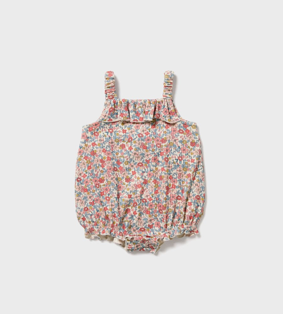 Floral baby romper on a white background