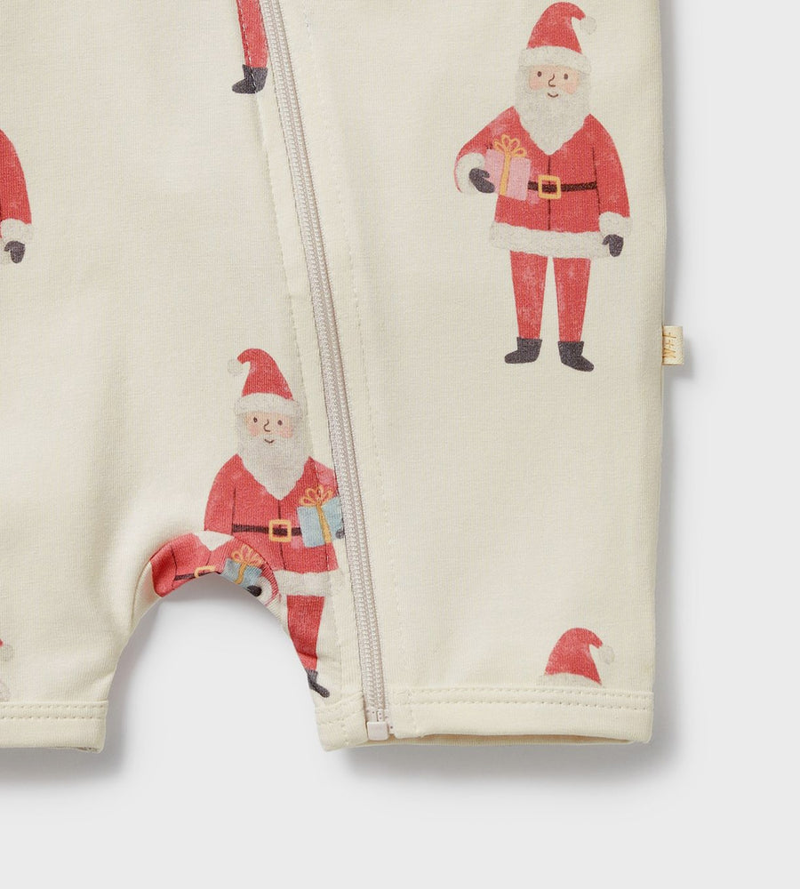 Folded baby romper with Santa Claus pattern on a white background