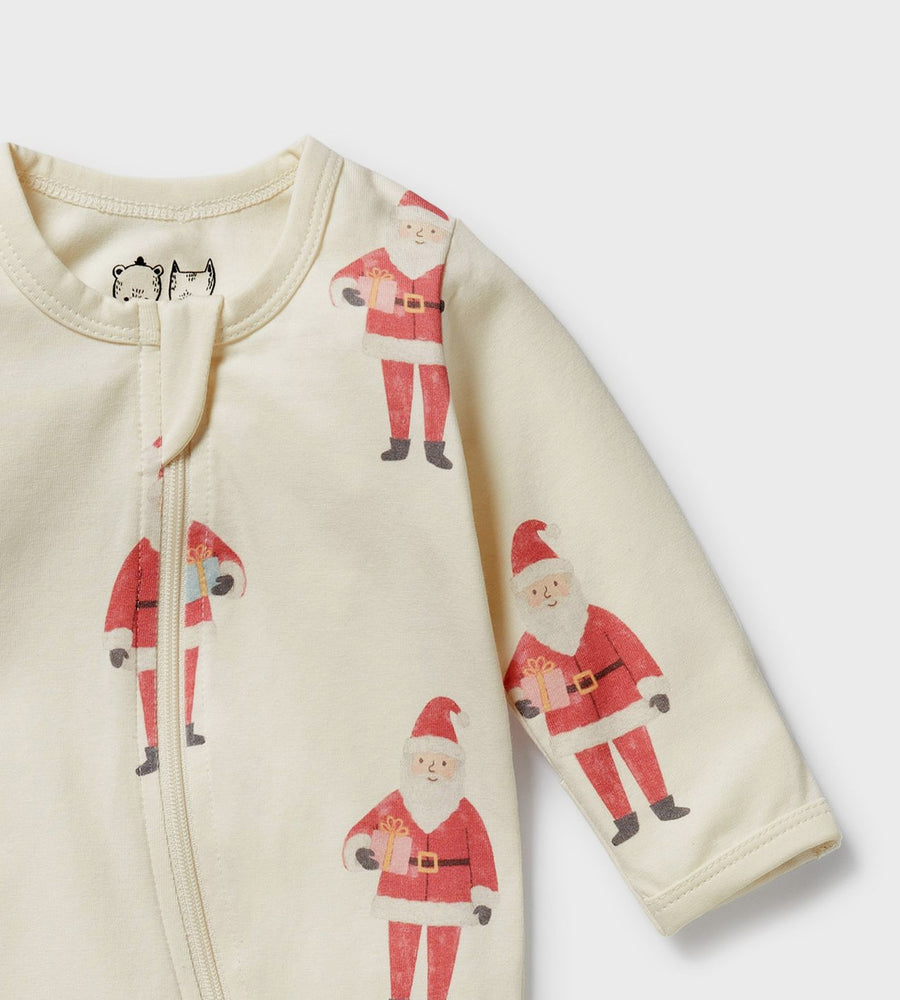 Baby onesie with Santa Claus prints on a light background