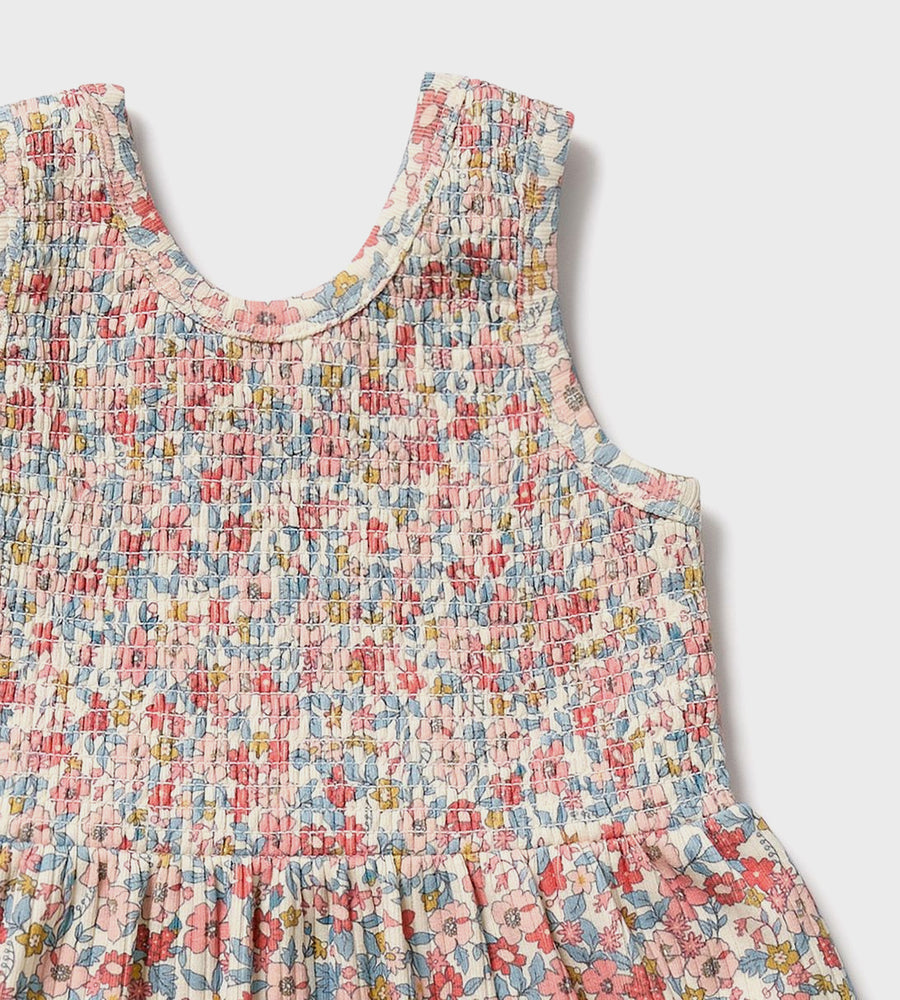 Floral dress with a textured pattern on a light gray background